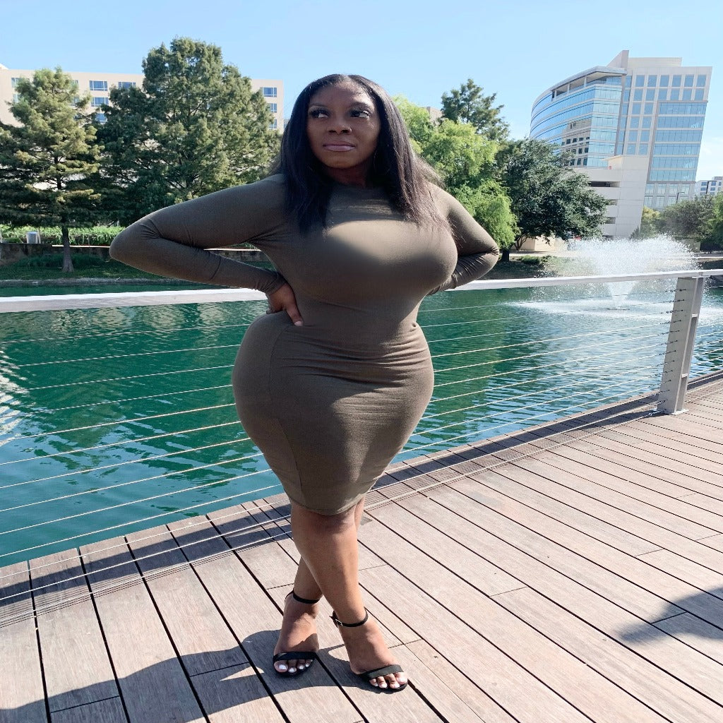 long sleeve bodycon dress in the color olive wearing outfit at lake