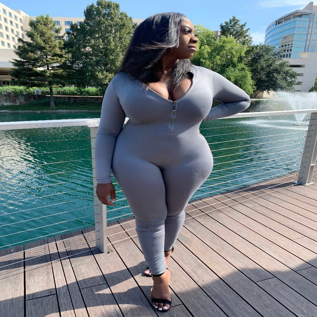 long sleeve jumpsuit in the color grey at the lake