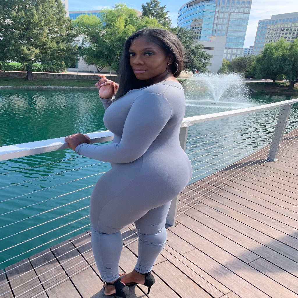 long sleeve jumpsuit in the color grey at the lake
