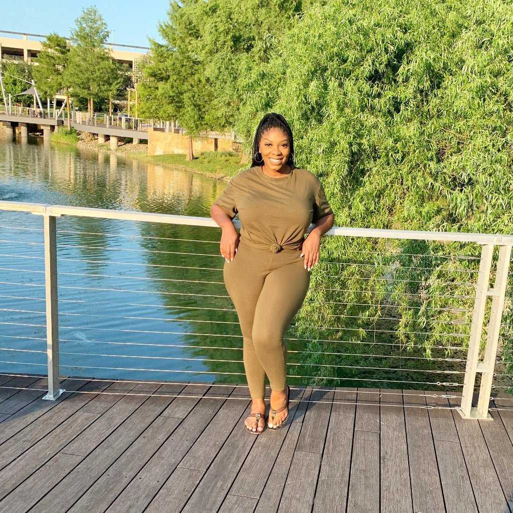 two piece legging set worn with gucci sandals at lake